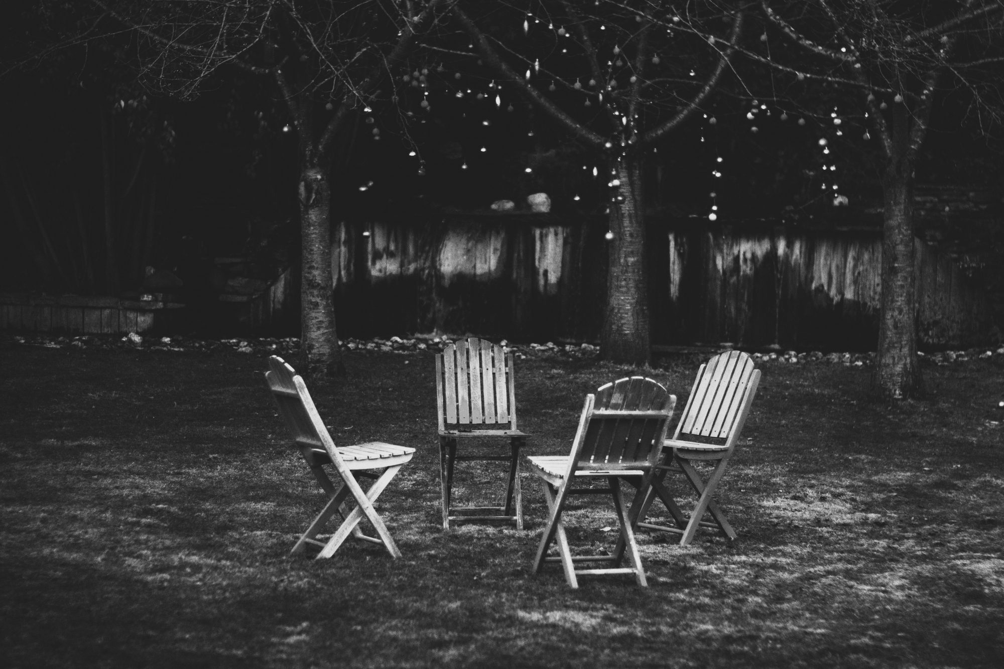Chairs gathered in a circle under trees